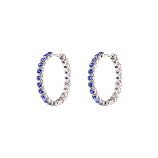 Optimism earrings metallic silver hoops with blue zircon